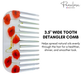 Detangler comb with red poppy designs on a white background, featuring the 'Parcelona' brand.