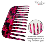 Pink and black hair comb with floral design, branded 'Parcelona', on a white background.