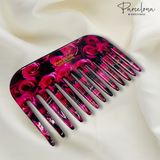 Pink rose patterned comb with 'Parcelona' branding on a white background